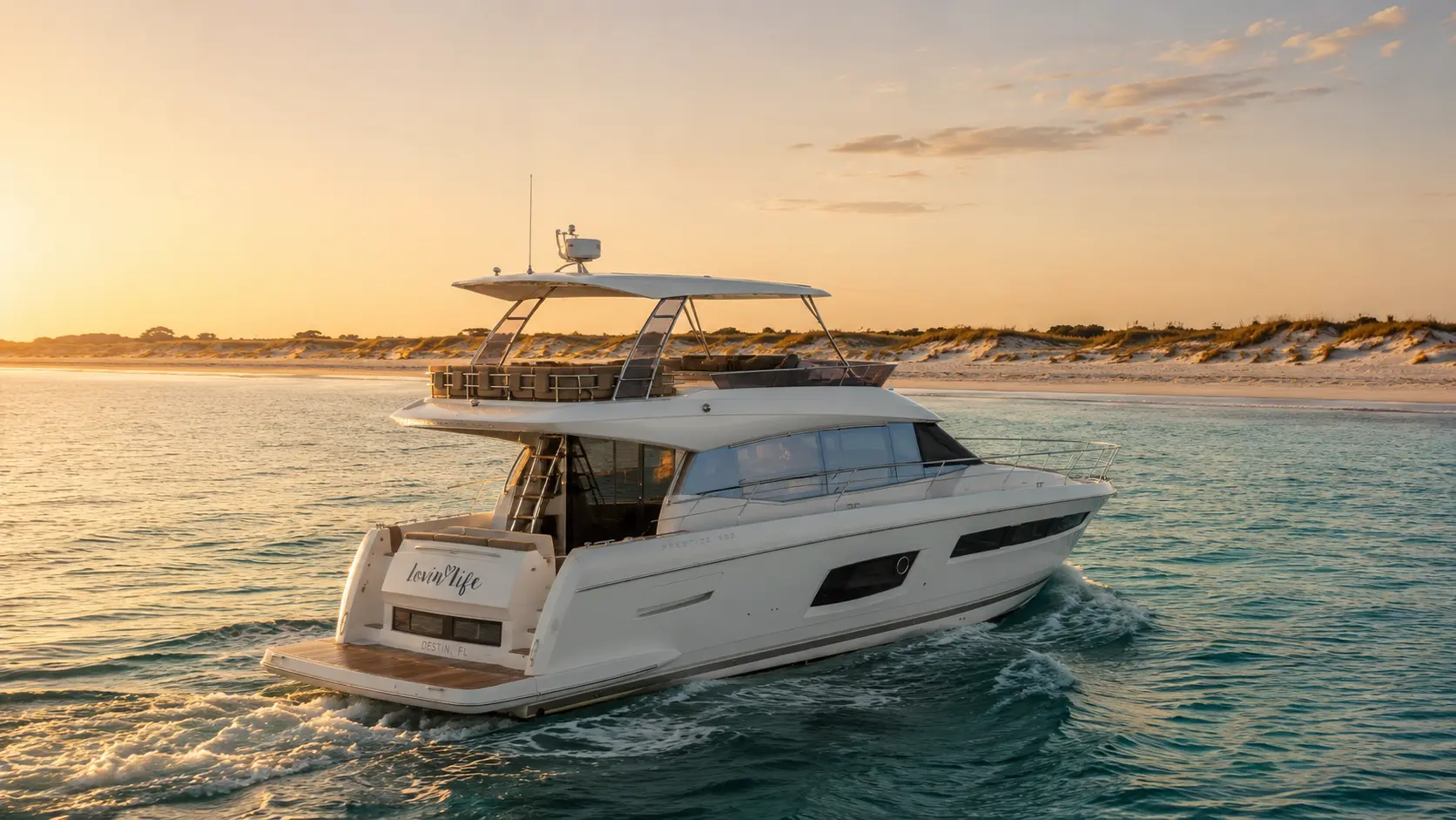 The Lovin' Life yacht cruising along the 30A coastline at sunset