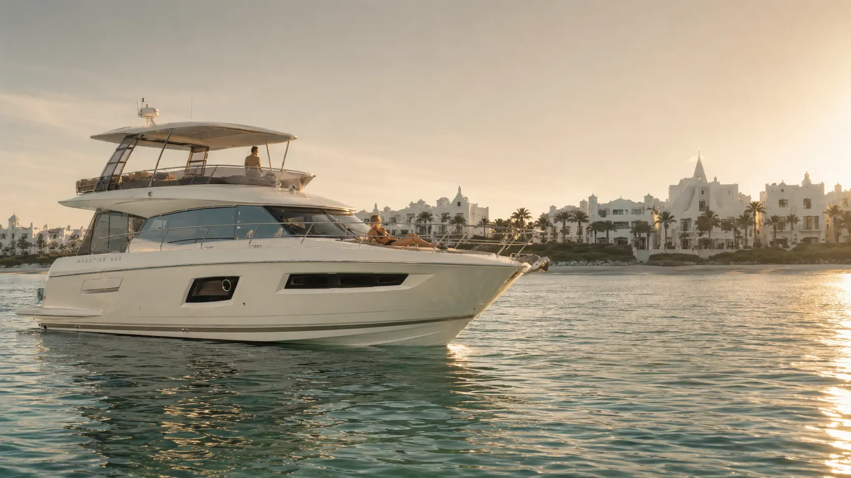 A private yacht charter's bow near Alys Beach, Florida, with guests relaxing at sunset