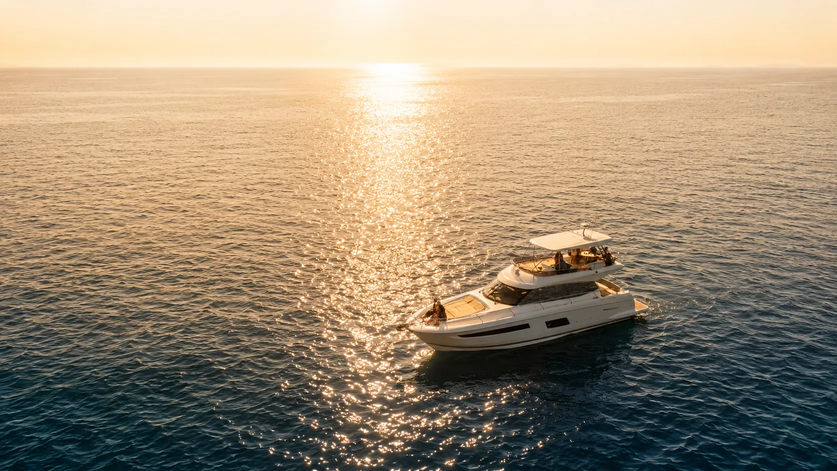 A Zen Marine Charter yacht anchored on calm golden-hour water off the Destin, Florida coastline