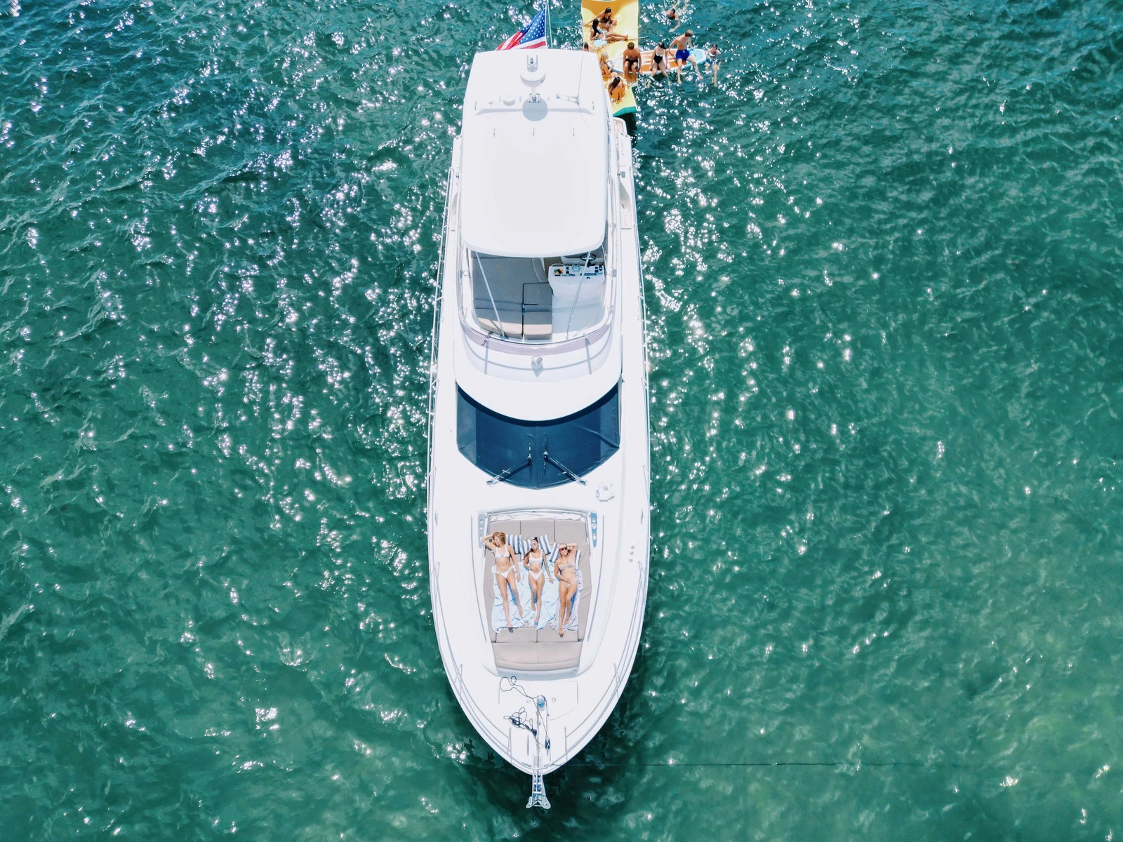 The Lovin' Life cruising open water at sunset on the Emerald Coast