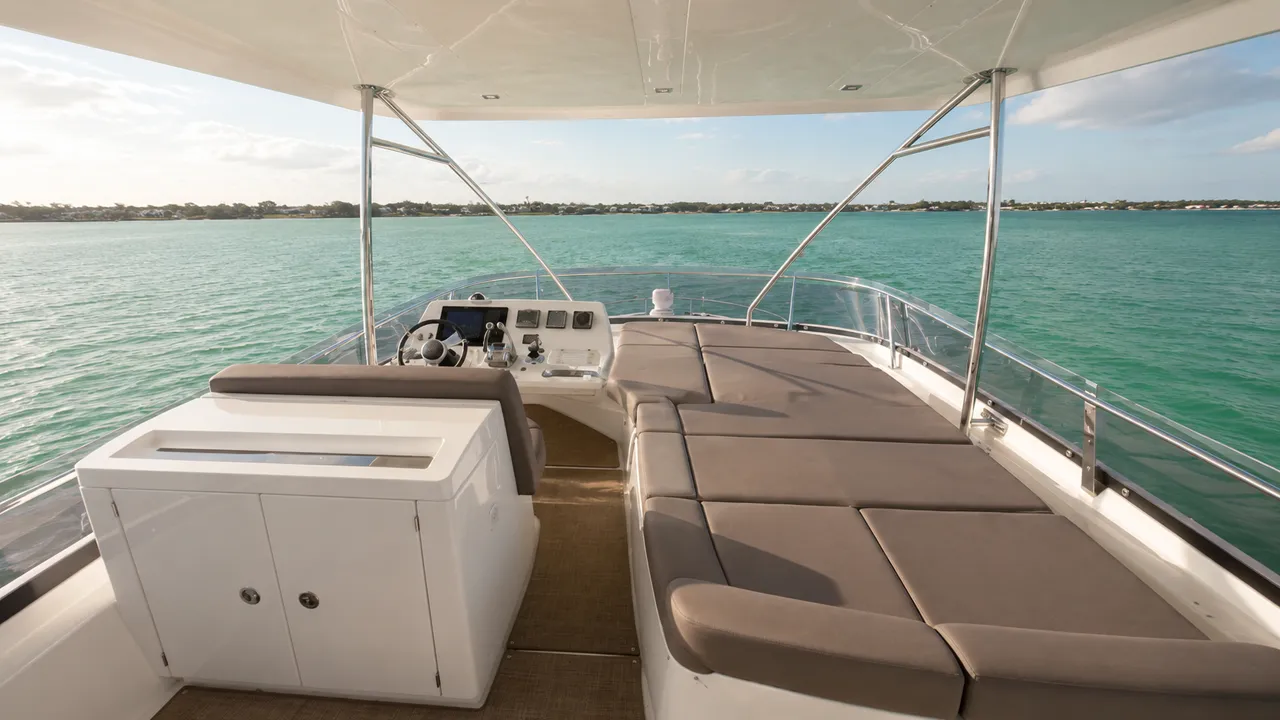 Shaded flybridge seating aboard a 57 foot Prestige 550 yacht overlooking the Gulf of Mexico