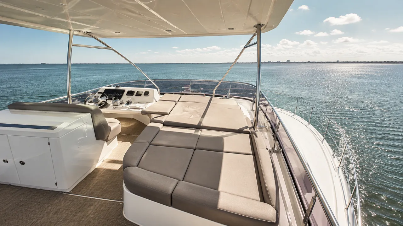 Shaded flybridge seating aboard a 57 foot Prestige 550 yacht overlooking the Gulf of Mexico