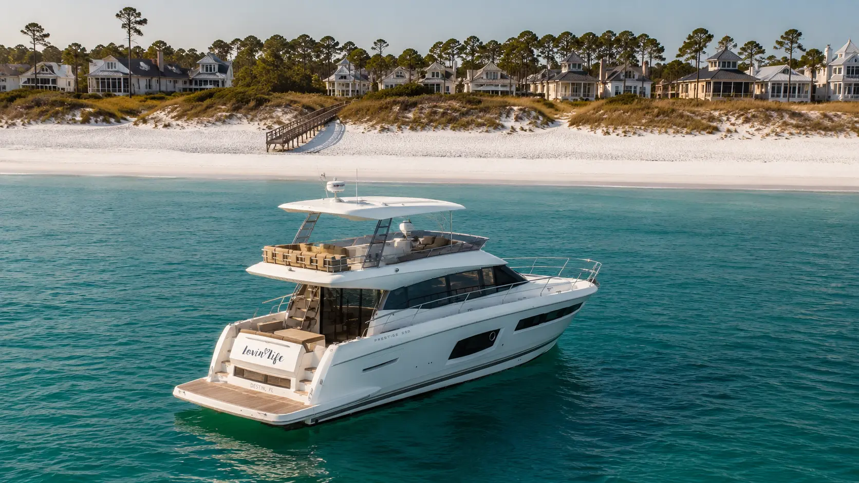The Lovin' Life yacht anchored off WaterColor, Florida, at sunset